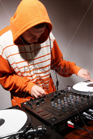 DJ playing music on vinyl turntables