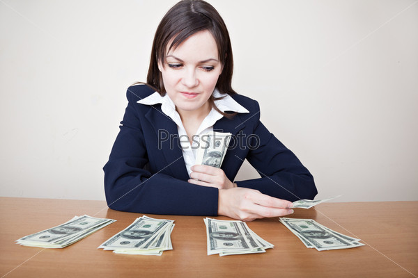 Young business woman with dollars