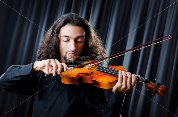 Violin player playing the intstrument, stock photo