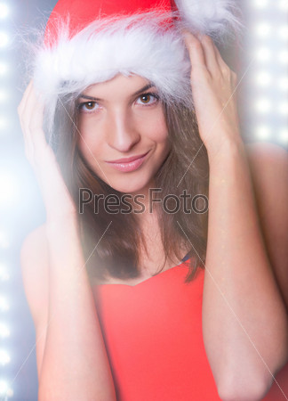 20-25 years od beautiful woman in christmas dress dancing at club while celebrating christmas party