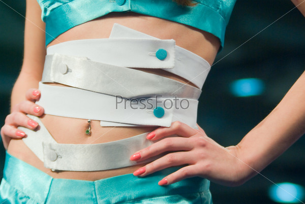 belt at the waist of a young woman