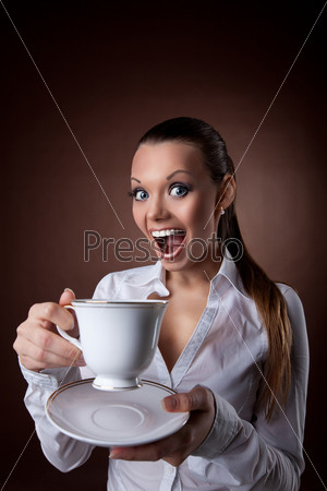 Funny Woman with cup of coffee smile at brown