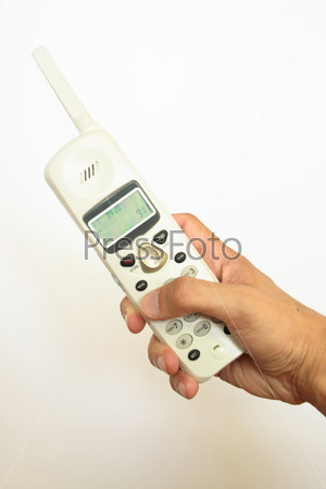 Трубка телефона в руке на белом фоне