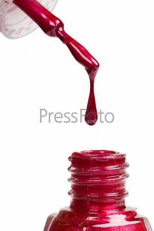 Red nail polish isolated over white background