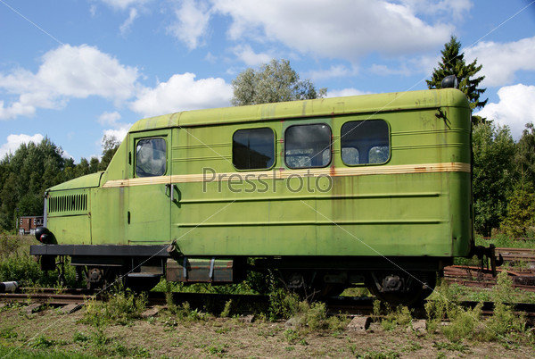 The railway car for transportation of workers in career, stock photo