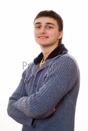 Young man standing and smiling on white background