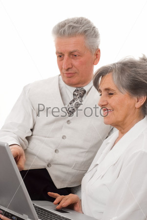 Man and woman looking at laptop white background, stock photo