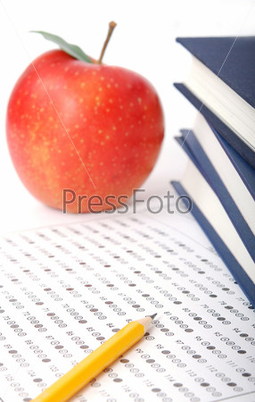 Education. Test score sheet with apple and books