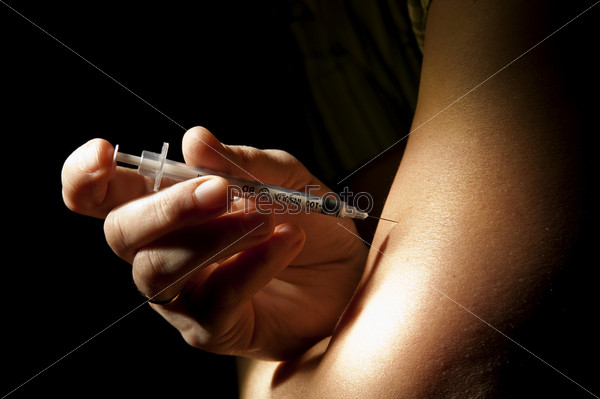 Patient injects insulin pen at hand