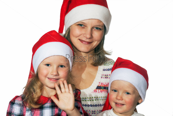 Happy mother with small boy and girl before the Christmas (on light background - not isolated)