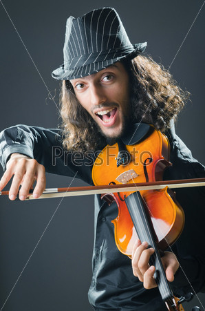 Fiddler playing the violin, stock photo