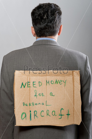 Man with cardboard sign Need Money