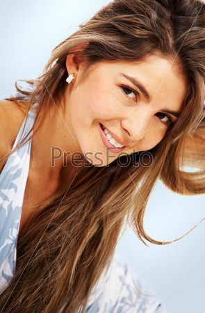 casual woman face smiling portrait over a light blue background