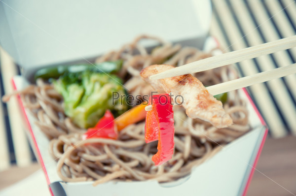 Take out food container with noodles, studio shot