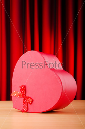 Heart shaped gift box against background