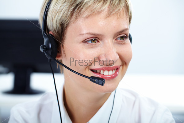Portrait of friendly customer service representative smiling, stock photo