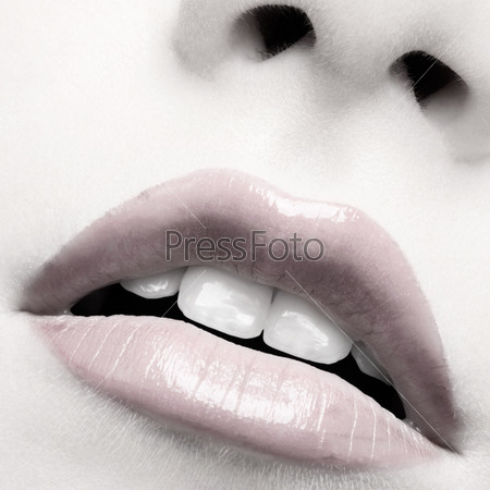 close-up of beautiful girl\'s lips zone make up