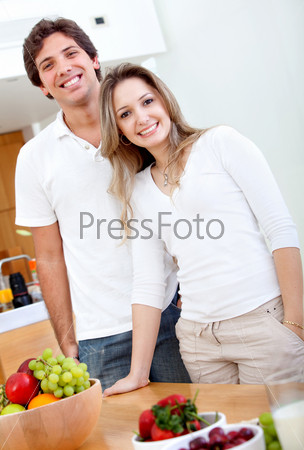 Beautiful healthy eating people at home smiling