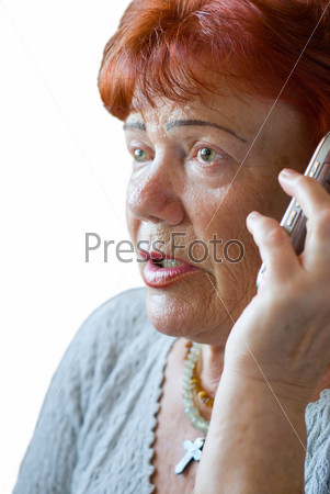 Frightened senior woman with cellphone