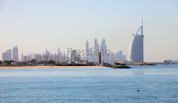 DUBAI, UAE - DEC 23: Burj Al Arab, a luxury hotel in Dubai, United Arab Emirates, on December 23, 2011. It stands on an artificial island out from Jumeirah beach and is shaped as the sail of a ship.