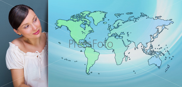 Attractive brunette young woman standing near board with world map. International service or traveling concept