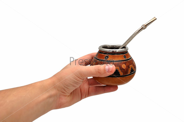 Yerba Mate tea in hand on a white background