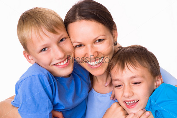 mom with her two children on a light background