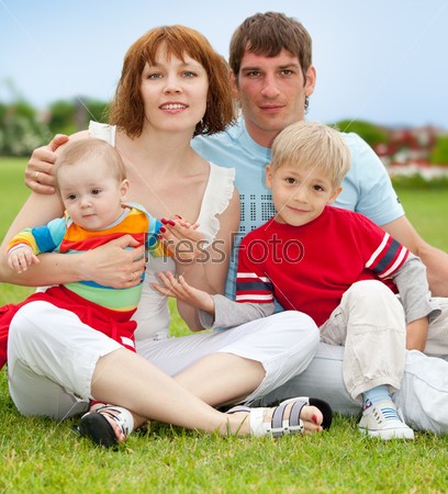Happy family with two children outdoor