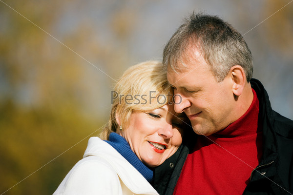 Mature romantic couple in a park