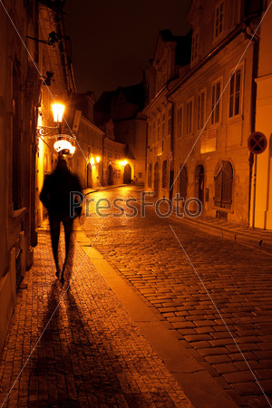A Beautiful Night View Of The Street And The Shadow Of A Man In Prague