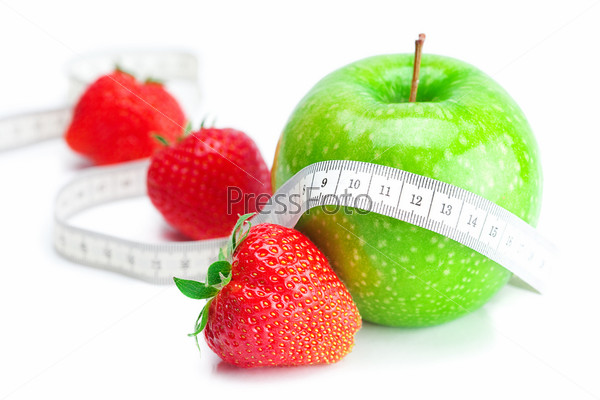 big juicy red ripe strawberries,measure tape and apple  isolated on white