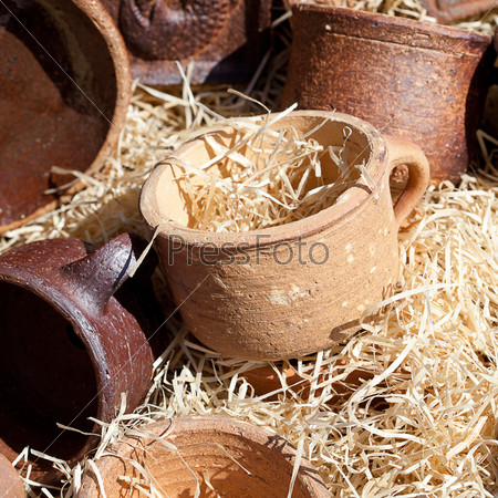 clay pots in the straw at the fair