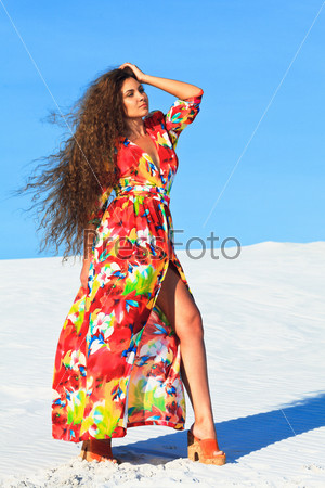 Beautiful woman with long hair in desert