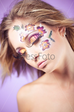 Flower face art and colorful eye makeup