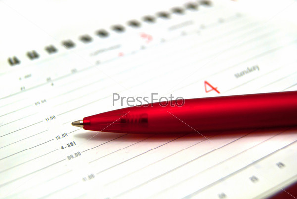 Red pen on diary, stock photo