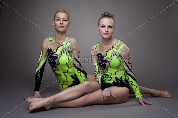 two Young beauty acrobats relax portrait