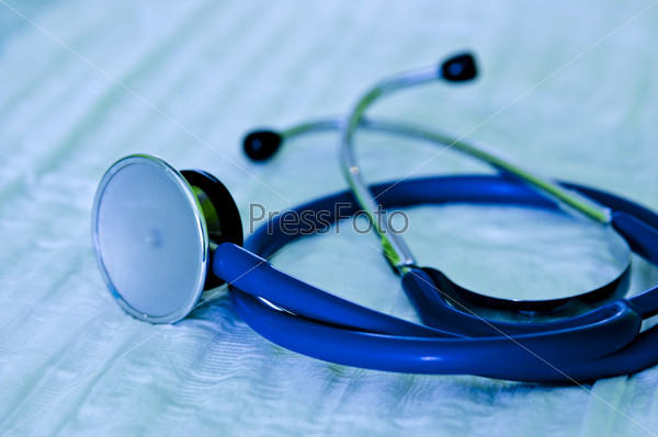 Shaded crome stethoscope lay on white workspace