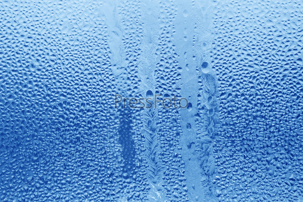 natural frozen water drop on window glass