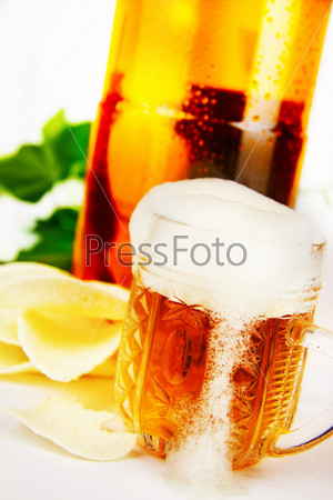 beer and chips on the background of a plastic bottle