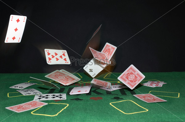 A Texas Hold \'m Poker theme with playing cards bouncing off the table in all directions.