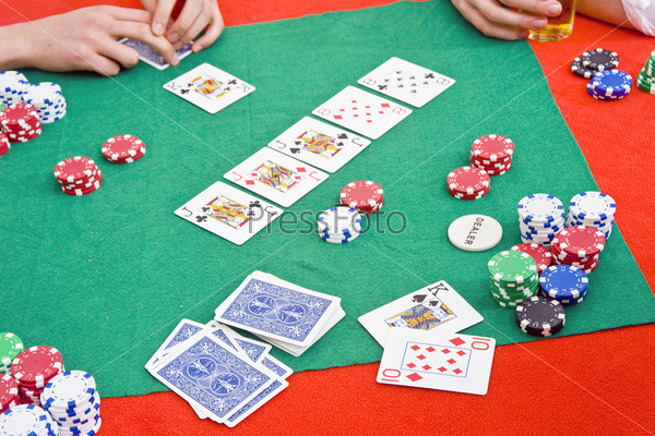 A poker game in progress with a big flop
