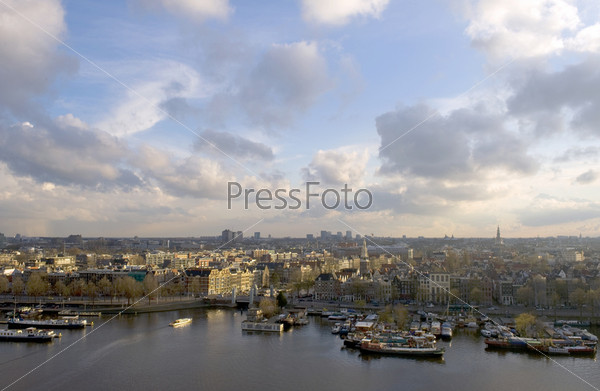 The skyline of Amsterdam, basking in the warm spring sunlight.