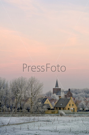 The winter dawn on small rural village of Ellewoutsdijk, Zeeland (Zuid-Beveland) the Netherlands
