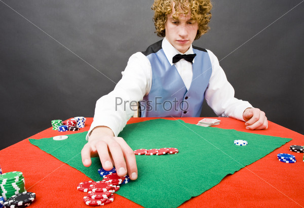 A dealer paying out a player after a winning a game