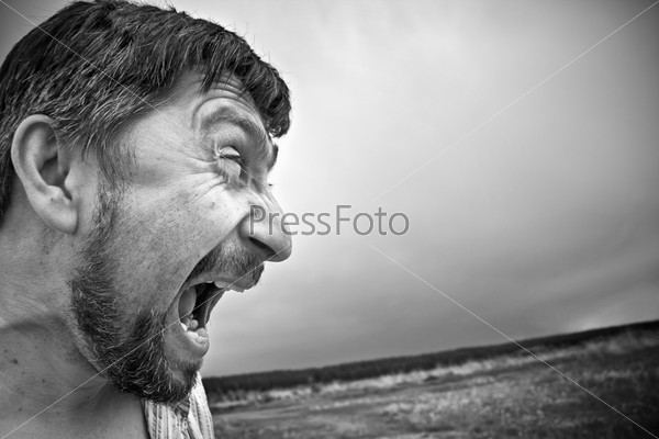 an aggressive angry man screaming