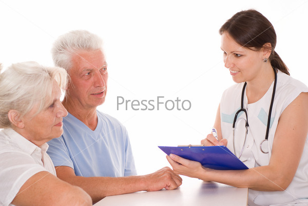 Young doctor testing old couple.JPG