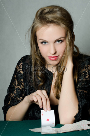 The beautiful girl with a playing card