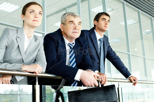 Business team looking confidently in future