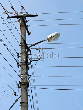 Pole with electrical lines and street light