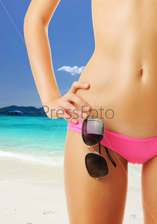 Woman with beautiful body at beach